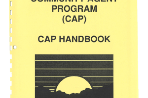 The cover of the Community Agent Program (CAP) CAP Handbook. There is a small image depicting a sun rising over a mountain range. There is a DSS logo in the top left hand corner